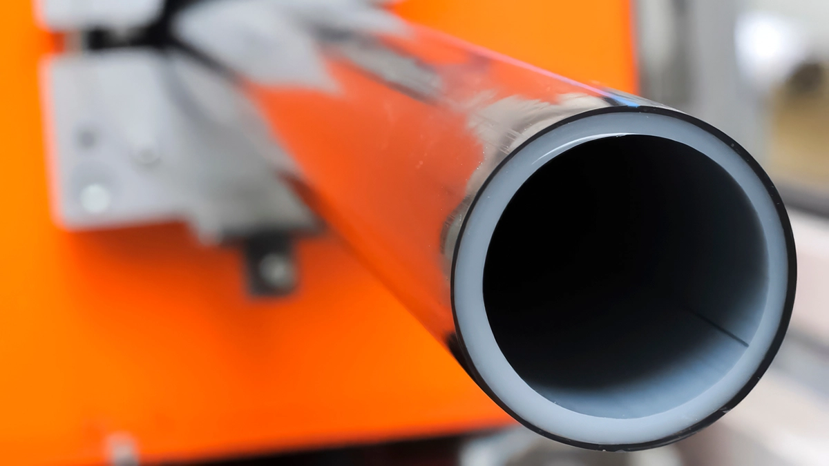 Cross-section of an industrial hose end showing the smooth inner liner