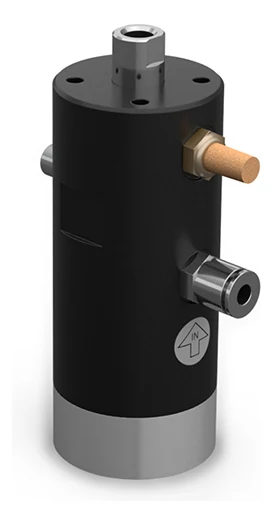An adjustable piston vibrator of the round housing type, seen from the front at an angle: a black cylinder on a grey base, with a brass silencer and a steel air connection on the side, a short shaft on top and an arrow marked IN embossed in the housing.