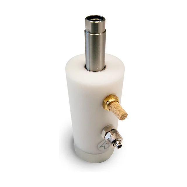 An adjustable piston vibrator with a white nylon housing, seen from the front: a cylinder with a brass silencer and a steel air connection on the side, and on top a bright steel shaft with two masses screwed onto it.