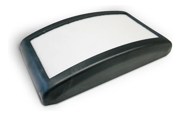 An I100 fluidisation pad with a white porous face in a black polyamide body, seen from the front at an angle.