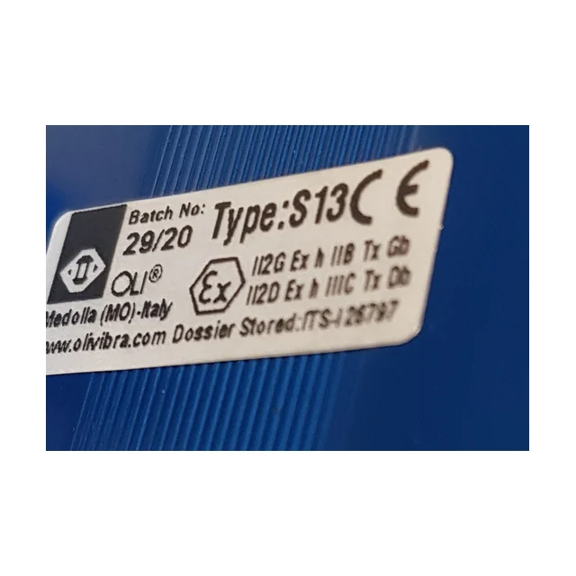 Close-up of the nameplate on a ball vibrator, stuck to the blue body. It reads Batch No 29/20, Type S13, the CE mark, OLI&reg; Medolla (MO)-Italy, www.olivibra.com, the Ex hexagon and the lines II2G Ex h IIB Tx Gb and II2D Ex h IIIC Tx Db.