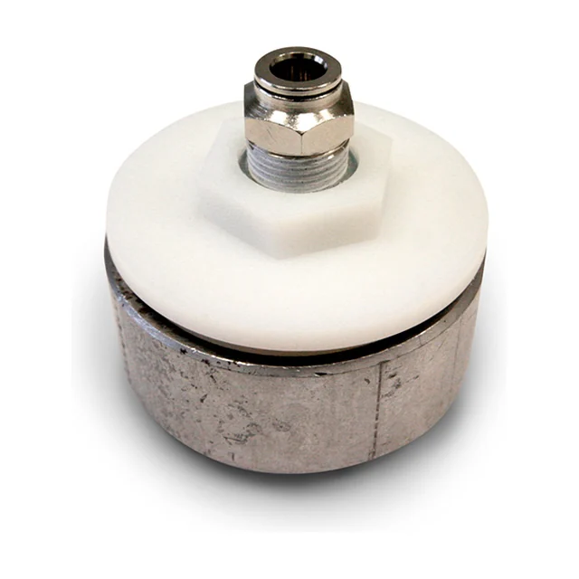 A U060 fluidisation nozzle seen from behind: the air connection at the top centre, the white polyamide body with its hexagon around it and the steel ring below. The porous face turns towards the material and is not visible here.