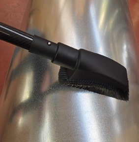 CleanUp pipe brush in action on metal surface