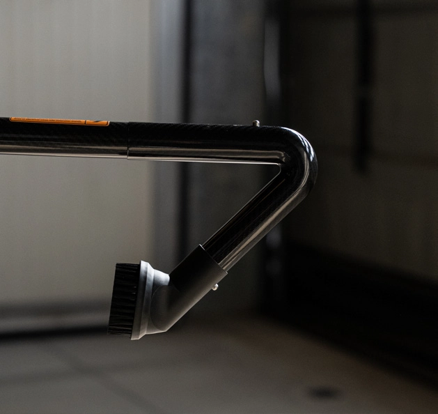 CleanUp carbon fibre system detail with orange WARNING label &ndash; electrical hazard marking