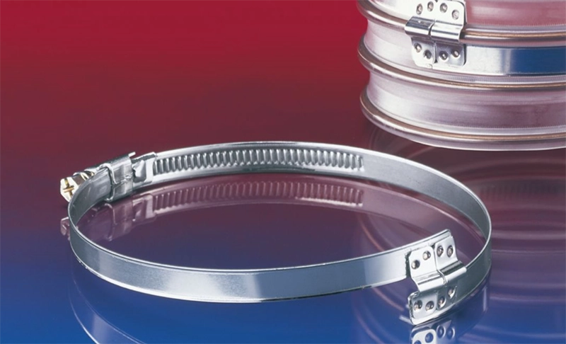 NORRES CLAMP 212 brospændebånd – fremvist åbent på bord, viser bro-geometri og bånd.