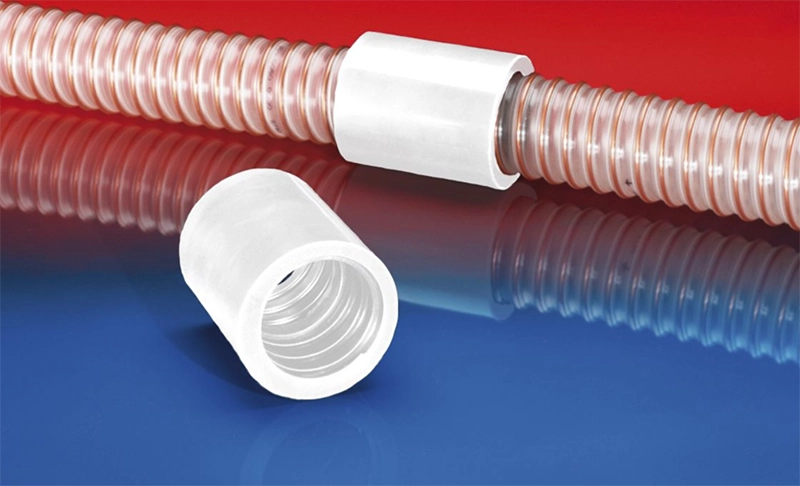 NORRES CONNECT 246 FOOD – hvid fødevaregodkendt slangekobling monteret på gennemsigtig spiralforstærket slange.