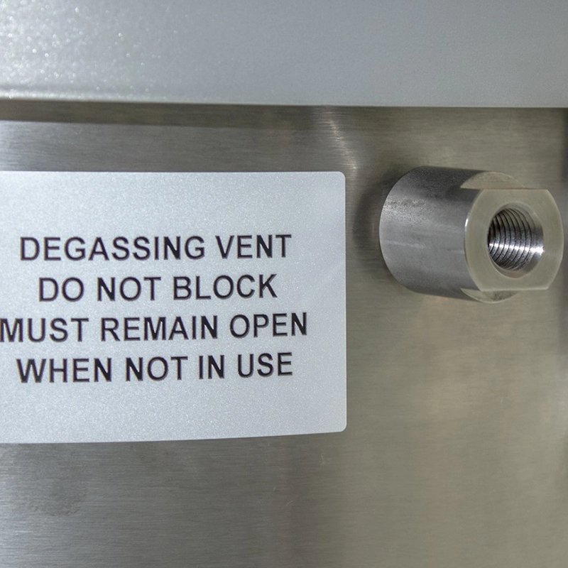 Degassing vent på Tiger-Vac C-10 EX – sikkerhedsudluftning med ‘Do Not Block’ advarsel, for korrekt håndtering af gasser under inertisering